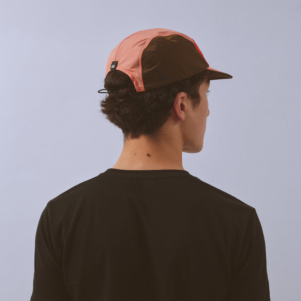 Pacer Cap - Flame Red / Coral / Brown — VÅGA running cap — worn, additional angle
