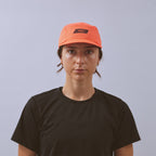 Feather Racing Cap - Neon Coral — VÅGA running cap — worn