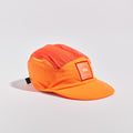 Transit Lite Cap - Neon Orange / Coral — VÅGA running cap — front angled view