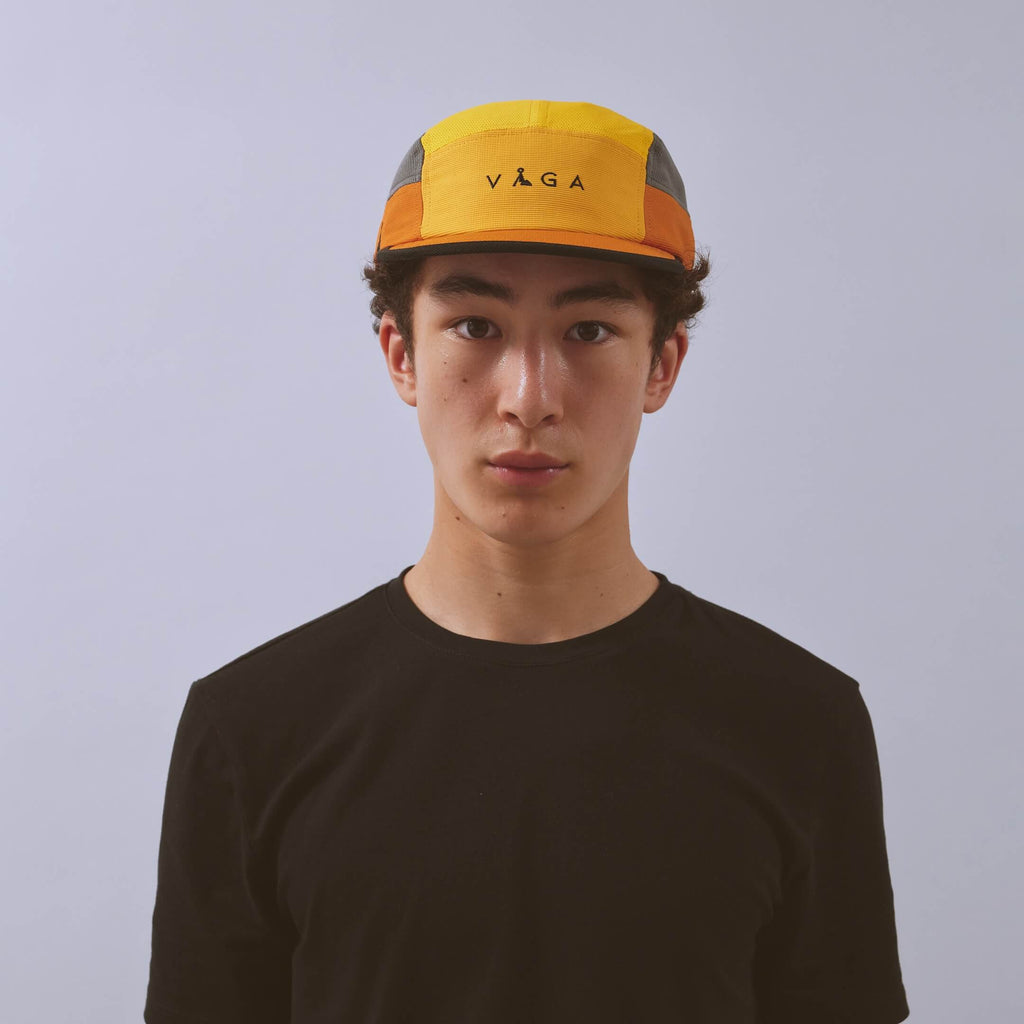 Club Cap - Yellow / Amber / Charcoal — VÅGA running cap — worn, front view