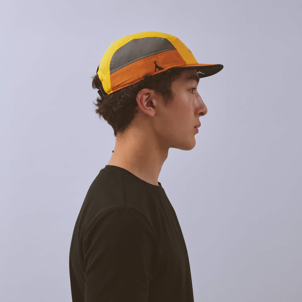 Club Cap - Yellow / Amber / Charcoal — VÅGA running cap — worn, side profile