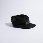 Feather Racing Cap - Black — VÅGA running cap — angled view