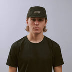 Feather Racing Cap - Black — VÅGA running cap — worn, front view