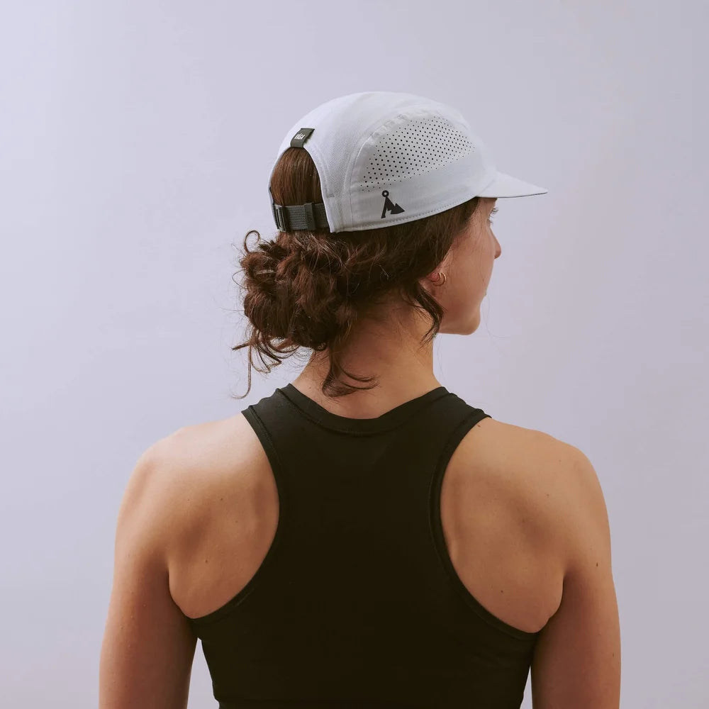 Feather Racing Cap - White — VÅGA running cap — worn, angled view